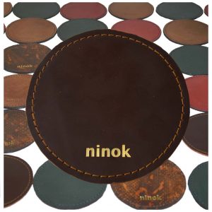 Untersetzer Braun mit Goldprägung, rund.